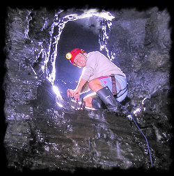 Man climbing up a waterfall